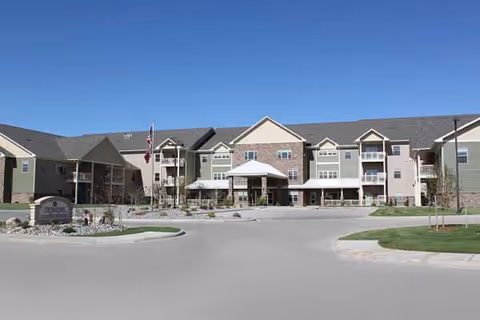 Exterior view of Primrose Retirement Community of Wausau with a central entrance.