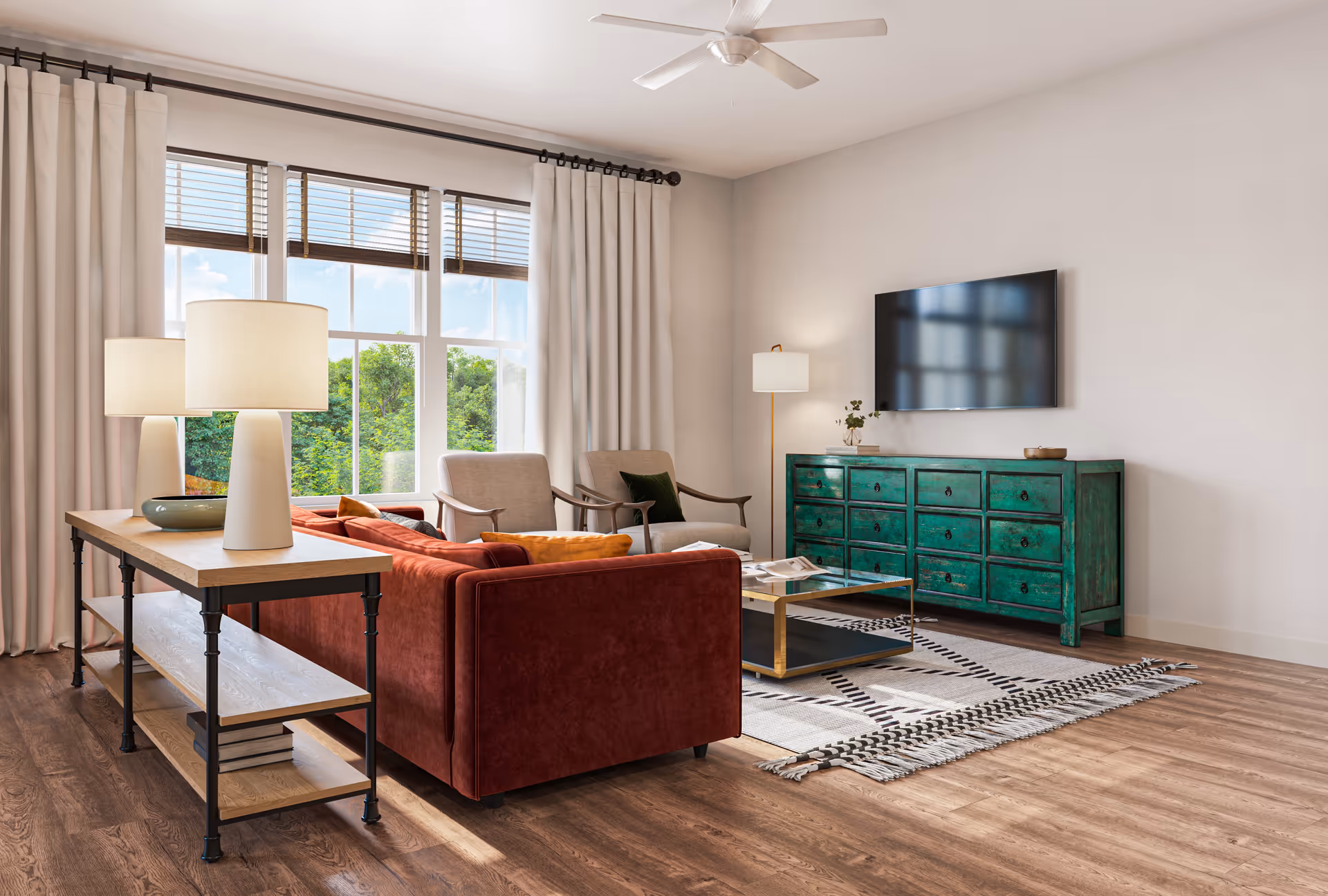 Bright living room with a red sofa, armchairs, a green dresser under a wall-mounted TV, coffee table and large window with curtains.