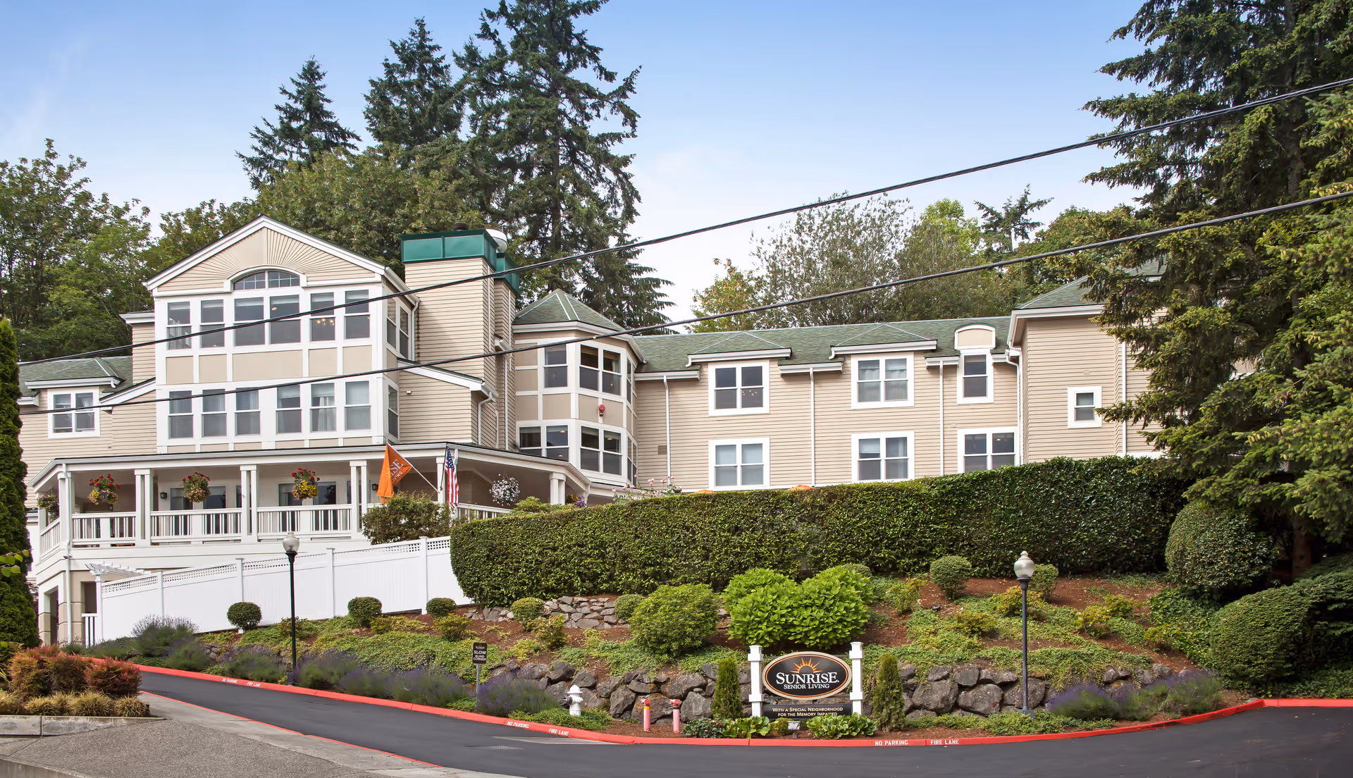 Vineyard Park of Mercer Island: senior living facility on a hillside with a landscaped front yard.