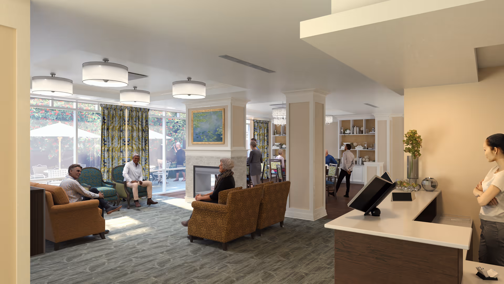 A bright and spacious senior living common area with several seniors sitting on comfortable chairs and sofas near a fireplace. Large windows with patterned curtains allow natural light to fill the room. In the background, there is a dining area with people standing and walking. A reception desk with a woman standing behind it is visible on the right side of the image.