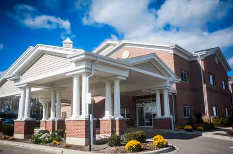 Indianspring Skilled Nursing Facility front entrance with brick, white columned portico.