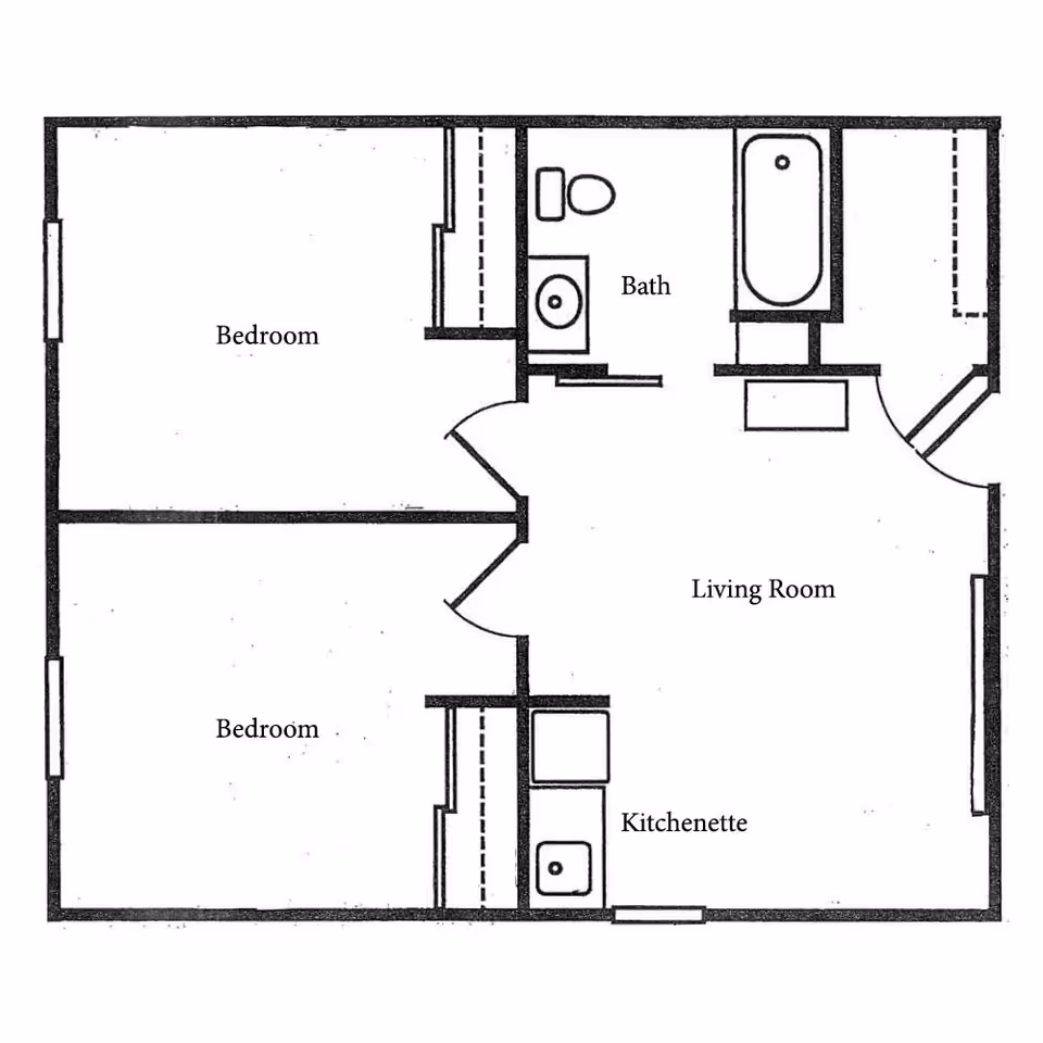 Black and white architectural floor plan of a living space labeled with two bedrooms, a bathroom, a living room, and a kitchenette.
