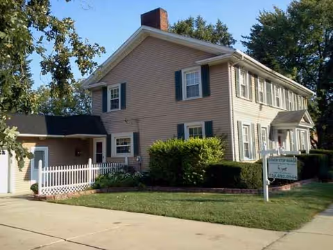 Exterior view of The Coach Stop Manor senior living facility front.