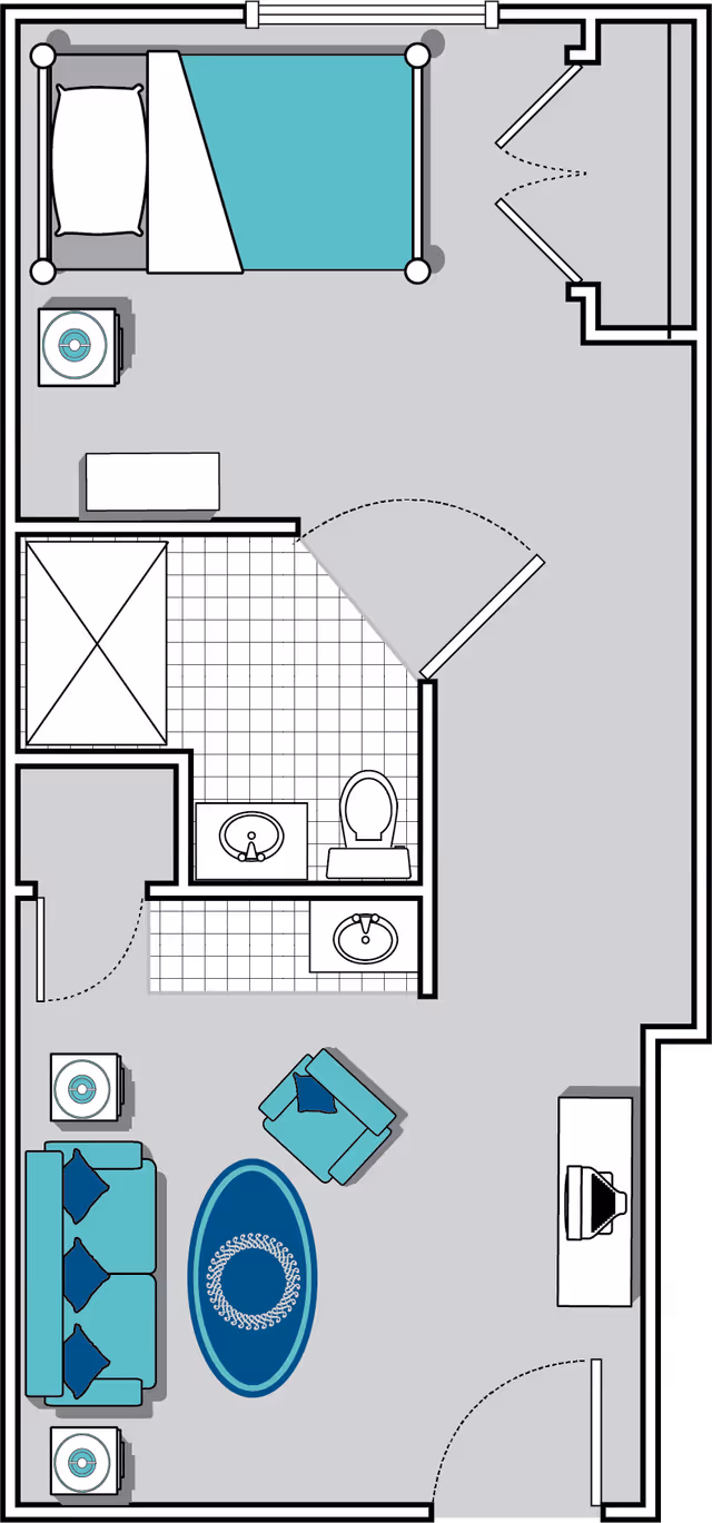 Floor plan of a senior living unit at Oaks at Charleston showing a bedroom with a bed and nightstand, a bathroom with a shower, toilet, and two sinks, and a living room area with a sofa, armchair, two side tables, an oval rug, and a TV on a stand.