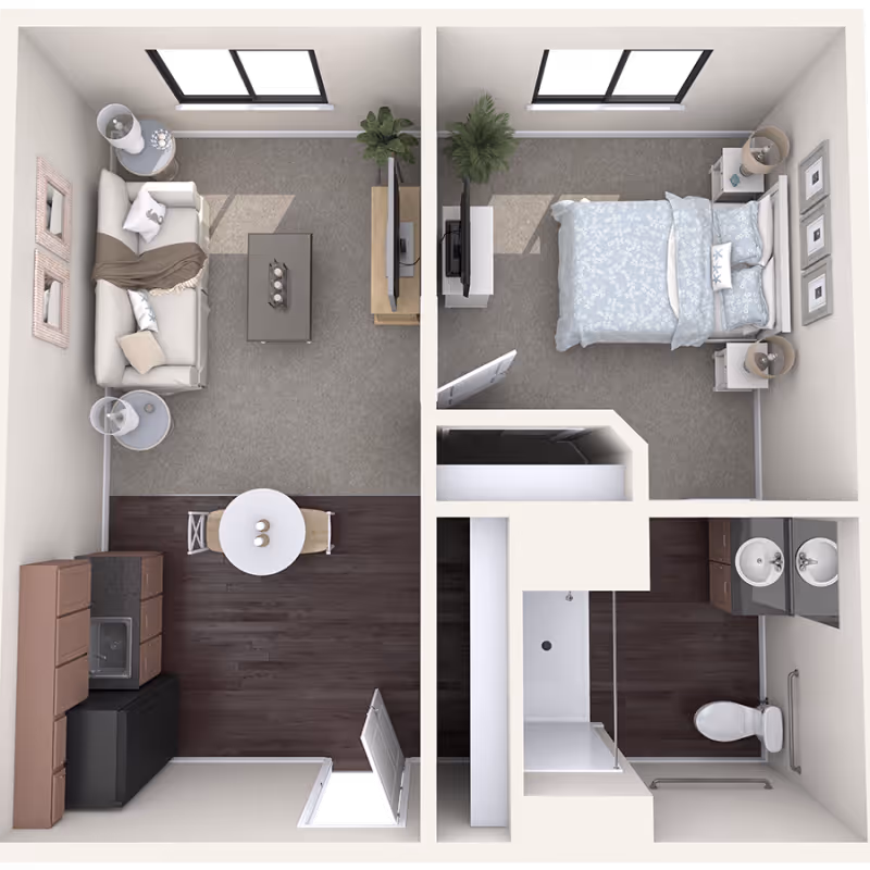 Top-down view of a one-bedroom apartment floor plan featuring a living room with a sofa, coffee table, TV, and side tables; a kitchen area with cabinets, sink, refrigerator, and a small dining table with two chairs; a bedroom with a bed, nightstands, lamps, and a TV; and a bathroom with a shower, toilet, and double sink vanity.