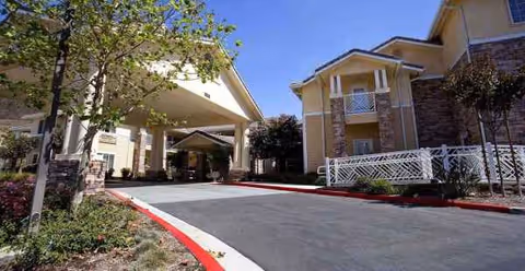 Exterior view of Holiday Simi Hills with a covered entrance and landscaped driveway.