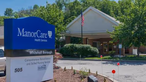 Exterior view of Whitehall Borough Post Acute facility with ManorCare sign