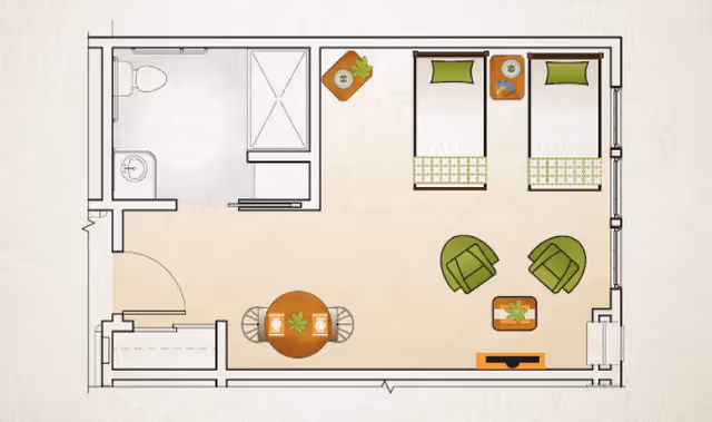 Floor plan of a room with two single beds, a bathroom with a toilet, sink, and shower, a small dining table with two chairs, two armchairs with a small table between them, and a TV stand.