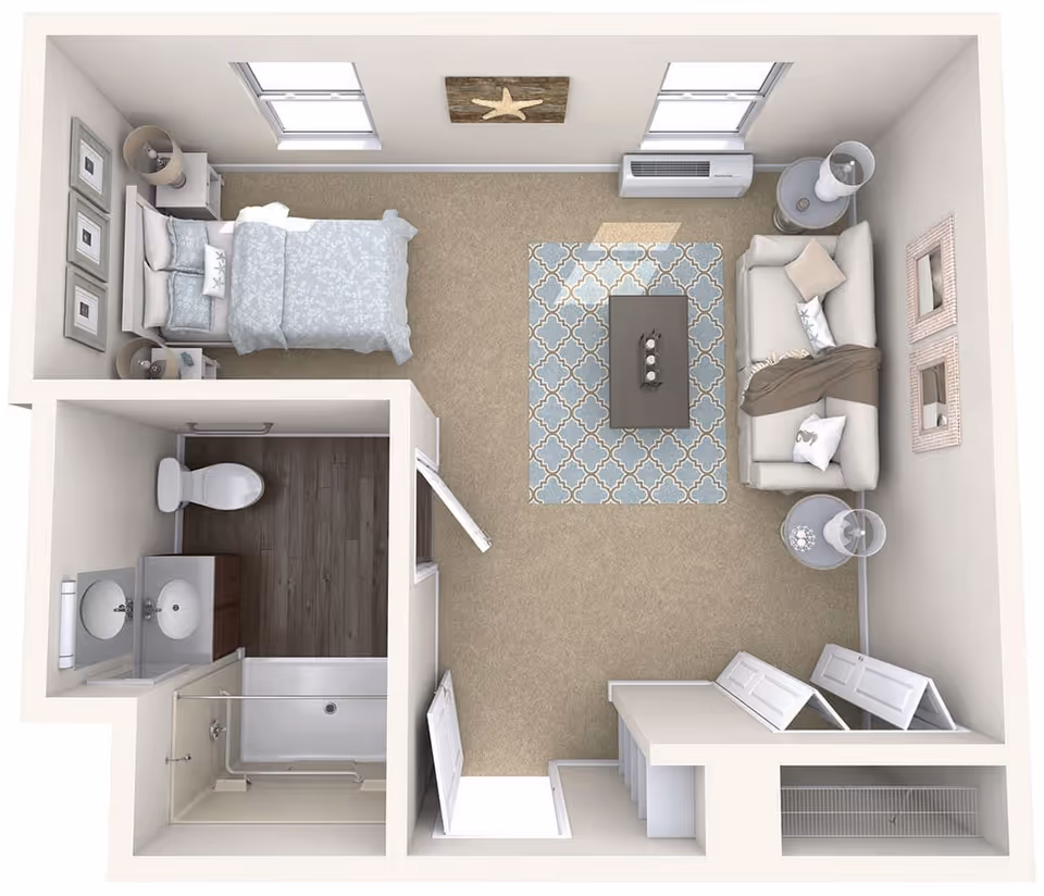 Top-down view of a small studio apartment layout featuring a bedroom area with a bed and nightstands, a living area with a sofa, coffee table, and side tables, and a bathroom with a toilet, sink, and shower. The room has two windows, a patterned rug, and decorative wall art.