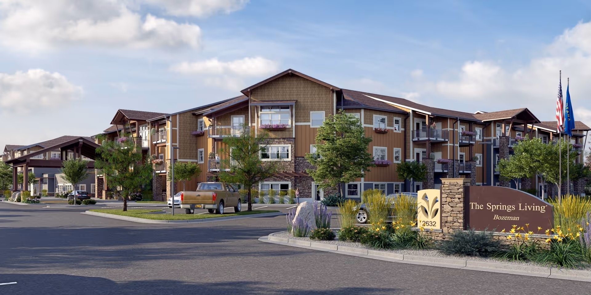 Front exterior view of The Springs at Bozeman senior living building with landscaped entrance and signage.