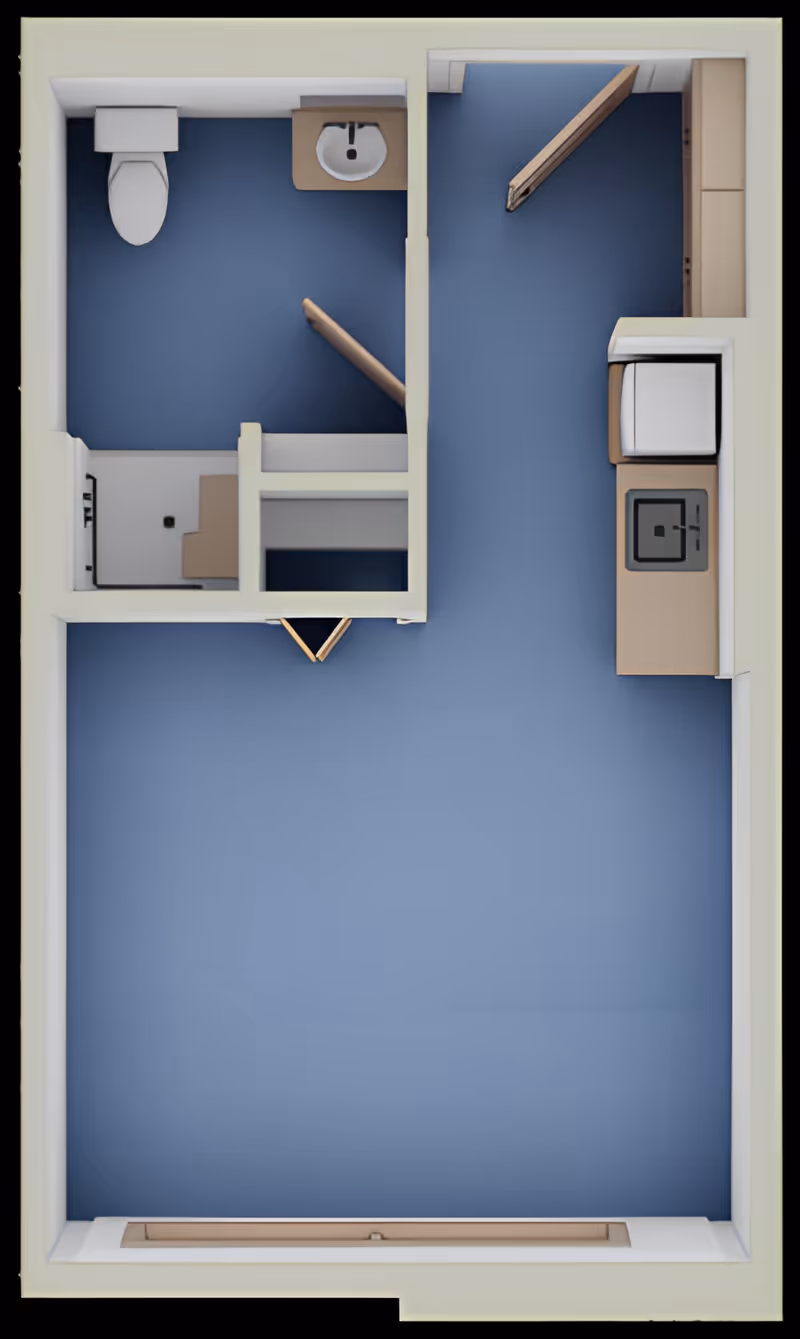Top-down view of a small apartment floor plan showing a bathroom with a toilet and sink, a kitchenette with a stove, sink, and refrigerator, and an open living area with blue flooring.