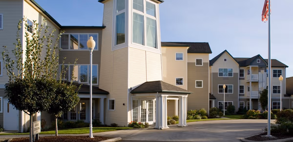 Exterior view of Avamere at St. Helens senior living campus with entrances.
