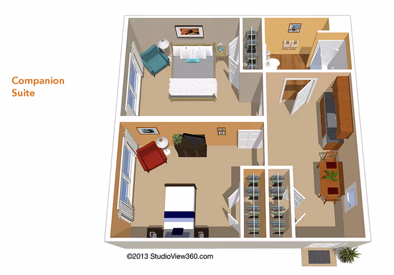 3D floor plan of a companion suite featuring two bedrooms, each with a bed, chair, and nightstand. The suite includes a shared bathroom with a shower, a kitchen area with cabinets and a dining table, and closets for storage.