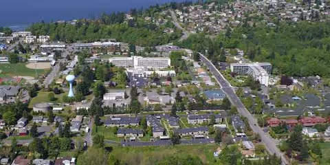 Aerial view of a Wesley Des Moines campus with multiple buildings and surrounding trees.