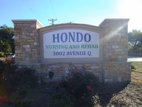 Stone entrance sign displays Hondo Nursing and Rehab at 3002 Avenue Q.