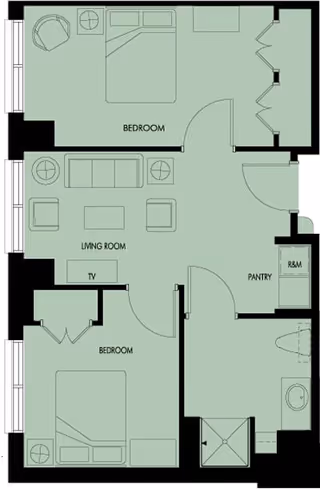 Floor plan of a residential unit showing two bedrooms, a living room with sofa and chairs, a pantry, and a bathroom with a shower and toilet.