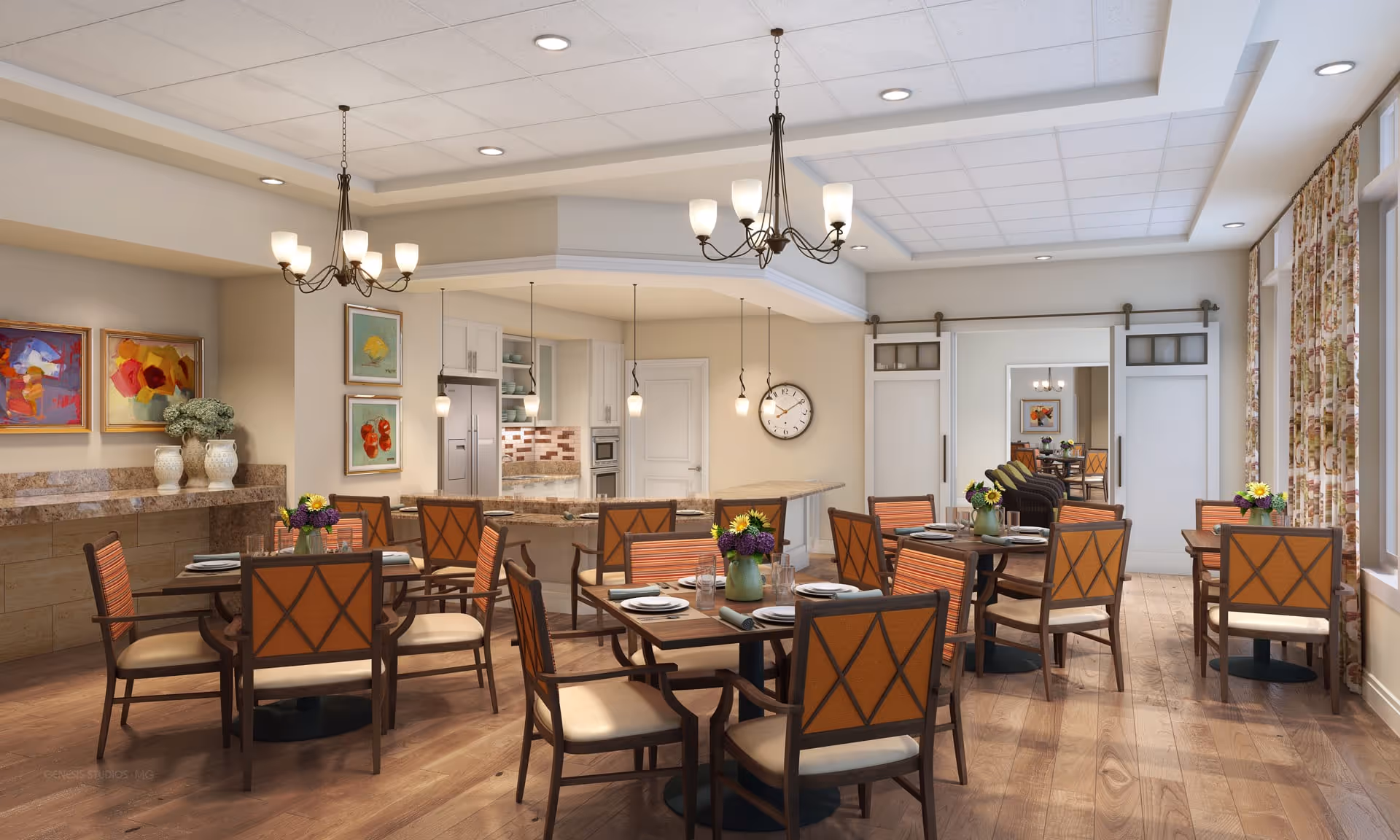 A bright and spacious dining room with multiple wooden tables and chairs arranged neatly. Each table is set with plates, glasses, and floral centerpieces. The room features hardwood flooring, two chandeliers, and pendant lights hanging over a kitchen counter in the background. The walls are decorated with colorful paintings and vases with flowers. Large windows with floral curtains allow natural light to fill the space.