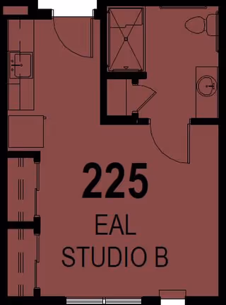 Architectural floor plan of a studio apartment labeled 225 EAL Studio B, showing a combined living and sleeping area, a kitchenette, and a bathroom with a shower, toilet, and sink.