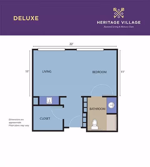 Floor plan labeled Deluxe for Heritage Village Assisted Living and Memory Care showing a layout with a living area, bedroom, closet, and bathroom. The living and bedroom areas each measure 11 feet by 11 feet, with a total width of 22 feet. The bathroom includes a toilet and sink, and the closet is adjacent to the living area.