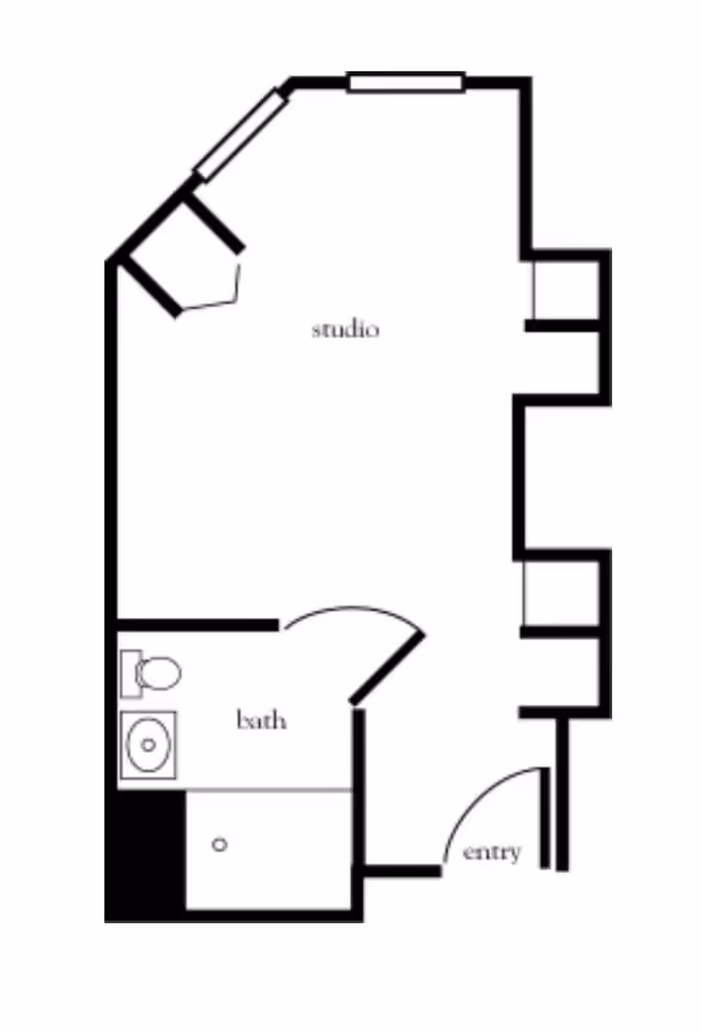 Black and white floor plan of a studio apartment with an entry area, a main studio living space, and a bathroom that includes a toilet, sink, and shower.
