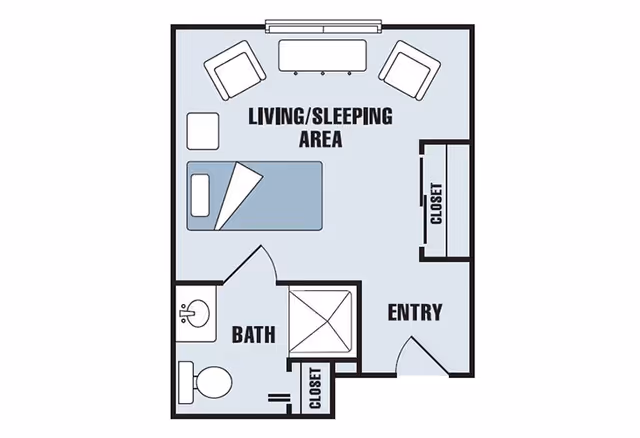 Floor plan of a senior living unit at Legacy Heights Senior Living Community showing a living/sleeping area with a bed, two chairs, and a small table, an entry area, a bathroom with a sink, toilet, and shower, and two closets.
