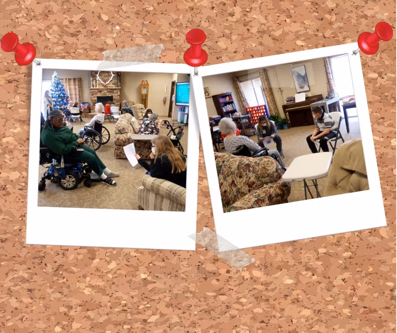 Two photos pinned on a corkboard background showing a senior living facility common area. The left photo shows elderly residents, some in wheelchairs, and a caregiver holding a paper, with a decorated Christmas tree and fireplace in the background. The right photo shows a small group of people, including an elderly woman and two caregivers, seated and engaged in conversation in a cozy room with floral couches, a piano, and a large Connect Four game.