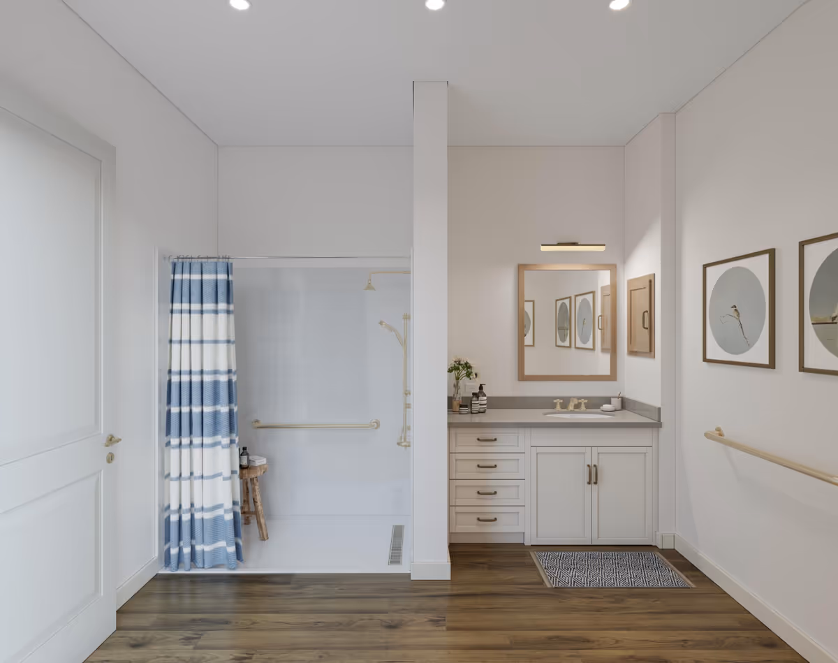 Accessible bathroom with a walk-in shower with a blue-striped curtain, vanity and mirror, grab bars, and framed wall art.
