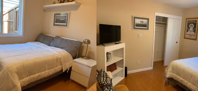 Small bedroom with a bed, nightstand and lamp by a window, a TV on a bookshelf, an open closet, framed wall art and hardwood floors.