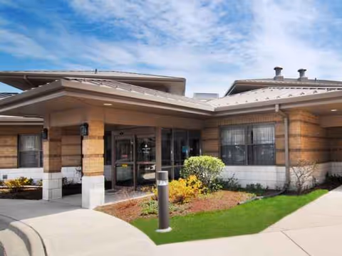 Alden Des Plaines Rehab & Health Care entrance with a covered canopy and landscaped walkway.