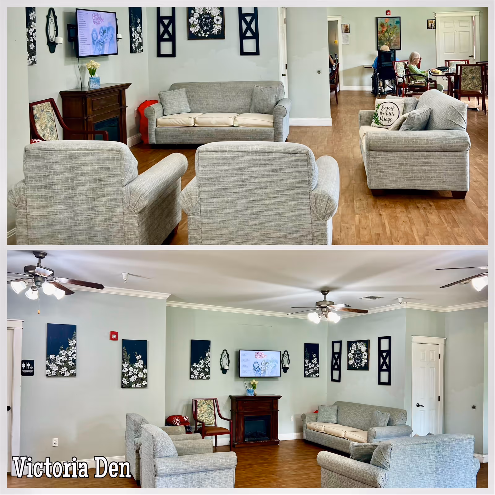 Two images showing a senior living facility common area named Victoria Den. The room has light green walls and wooden flooring. There are multiple gray upholstered chairs and sofas arranged around a small wooden electric fireplace with a TV mounted above it. The walls are decorated with floral artwork and mirrors. In the background, there are tables and chairs with elderly residents seated, one in a wheelchair. Ceiling fans with lights are visible on the ceiling.