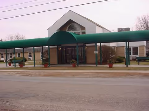 Exterior view of Birchwood Terrace Rehab and Healthcare entrance under a green canopy.