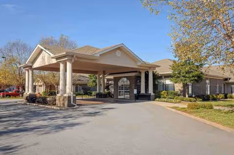 Life Care Center of Lawrenceville front entrance with a covered drive and landscaping