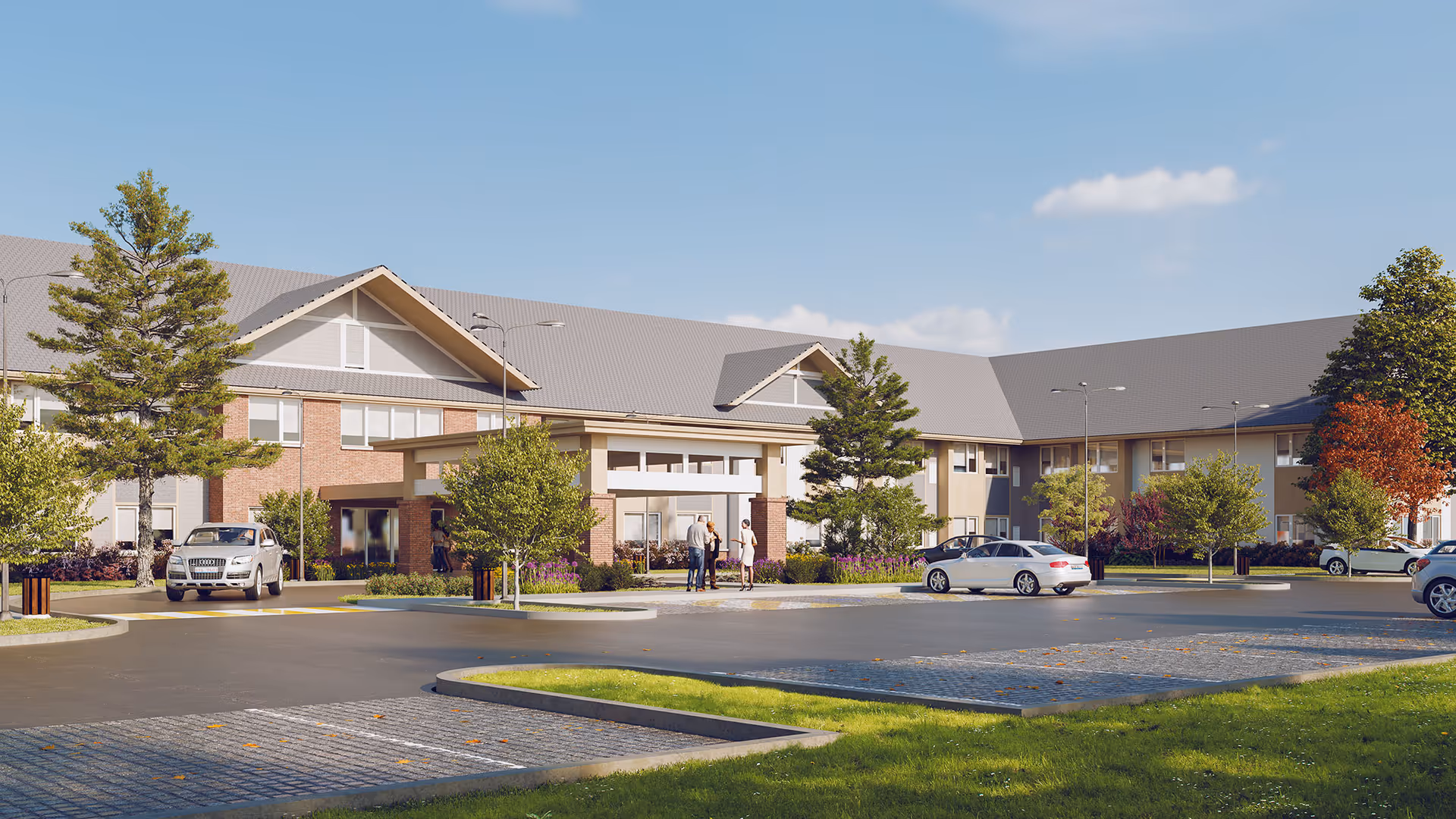 Entrance and front facade of a two-story senior living building with parked cars and landscaped grounds under a clear sky.