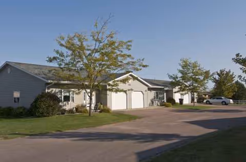 Exterior view of Tea Retirement Living facility with attached garages and driveway