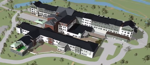 An aerial view of a senior living facility with multiple buildings and landscaped grounds.