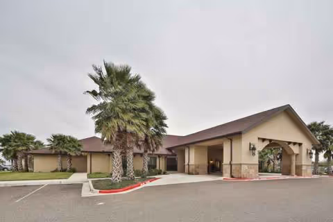Exterior view of Windsor Arbor View, a single-story senior living facility with a covered entrance.