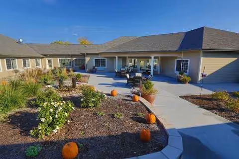 Front view of Grand View Alzheimer's Special Care Center with a landscaped outdoor courtyard.