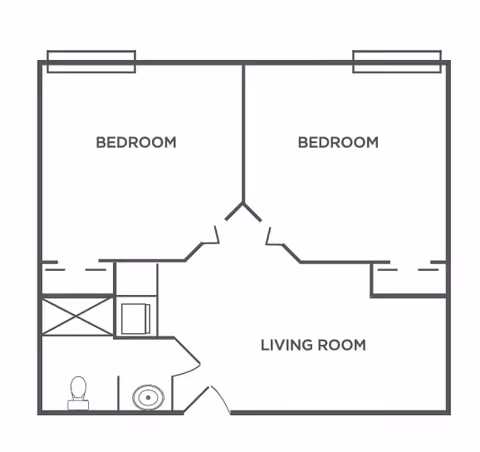 Floor plan layout showing two bedrooms, a living room, and a bathroom with a toilet and sink.