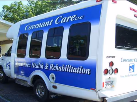 Blue Covenant Care senior care vehicle parked outdoors beside a building