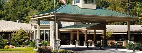 Front exterior of Paramount Senior Living at Manassas with a covered entrance.