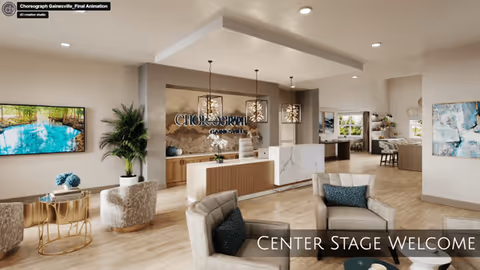 Modern bright reception and lounge area of a senior living facility with sofas, a reception desk beneath a 'Choreograph Gainesville' wall sign, plants and decorative lighting.