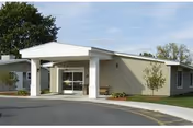 Front entrance of D’Youville Life & Wellness Community with a covered porte-cochere.