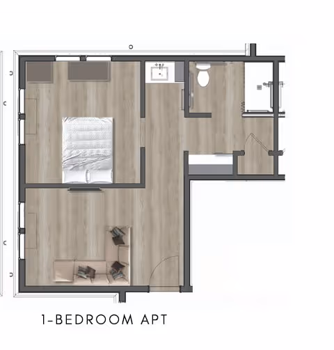 Floor plan of a one-bedroom apartment showing a bedroom with a bed, a living area with a sofa and chairs, a bathroom with a toilet and shower, and a small kitchen area with a sink.