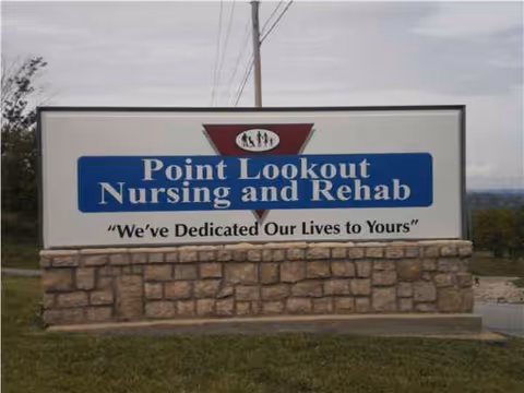 Outdoor sign on a stone base reading Point Lookout Nursing and Rehab