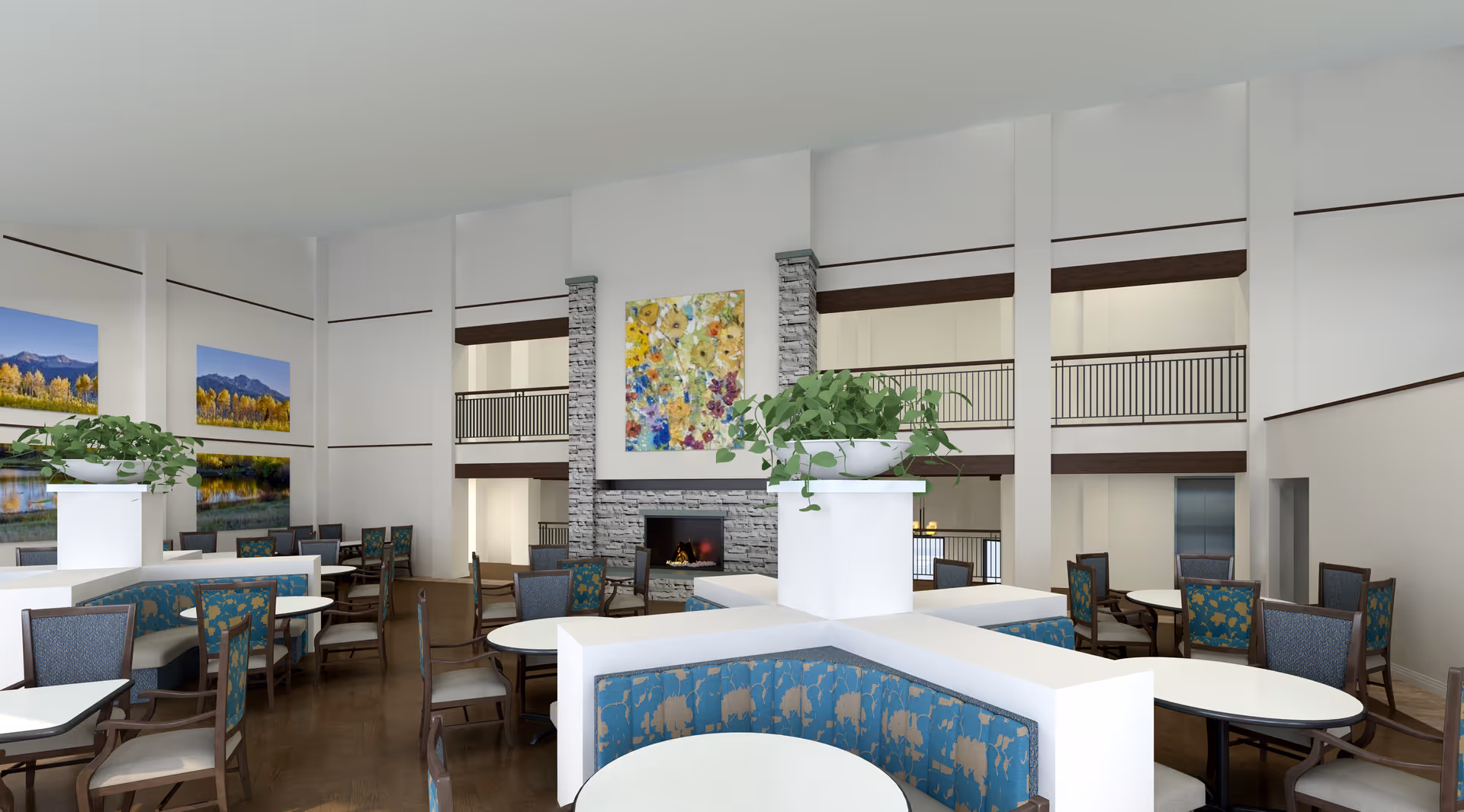 Bright two-story communal dining area with round tables, upholstered chairs, planters, and a central fireplace under colorful artwork.