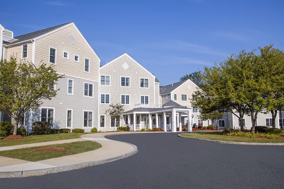 Exterior view of Benchmark at North Andover, showing a curved driveway and welcoming entrance.