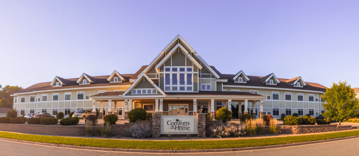 Exterior view of Comforts of Home Advanced Assisted Living in Menomonie, showing the large front entrance.