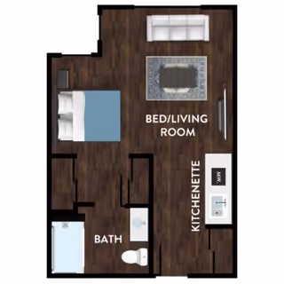 Floor plan of a senior living unit at Kipling Meadows Senior Living showing a combined bed and living room area with a sofa and coffee table, a kitchenette with a sink and microwave, and a bathroom with a shower, toilet, and sink.