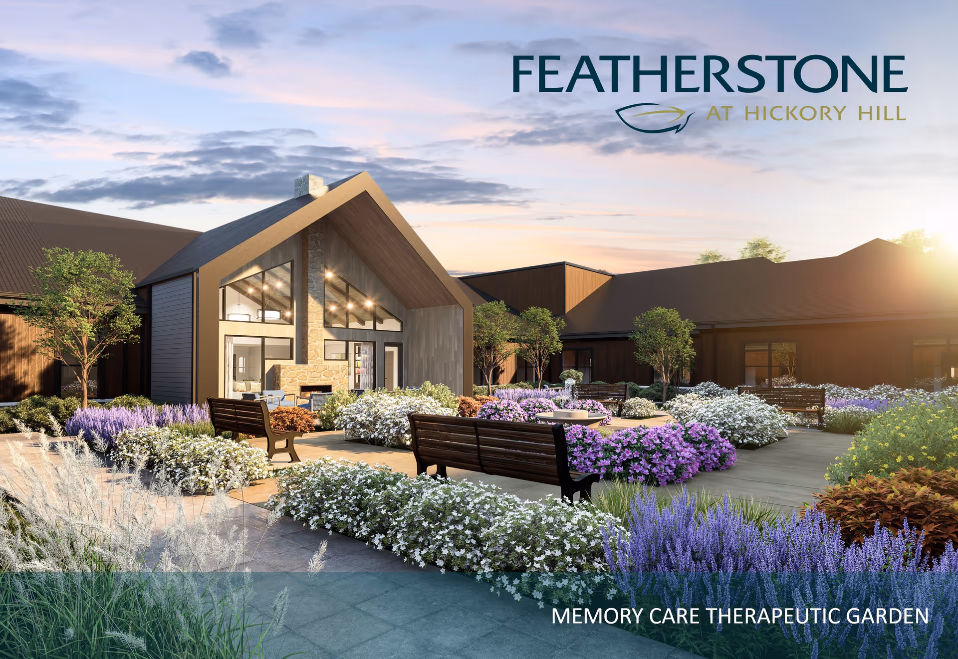 A beautifully landscaped therapeutic garden at FeatherStone at Hickory Hill featuring colorful flowers, shrubs, benches, and a modern building with large windows and a stone fireplace in the background during sunset.