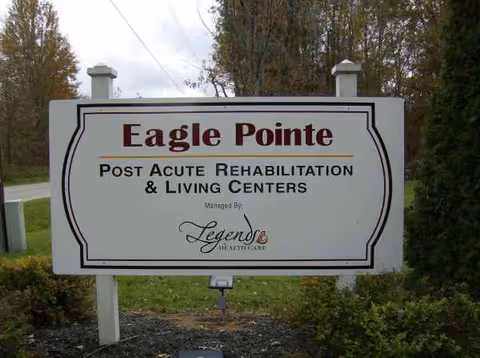 Large exterior sign for Eagle Pointe Post Acute Rehabilitation & Living Centers in front yard.